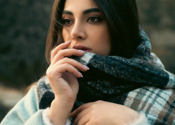 a woman with a scarf around her neck