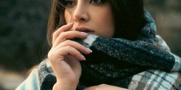 a woman with a scarf around her neck