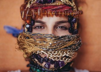 shallow focus photography of woman covered of accessories