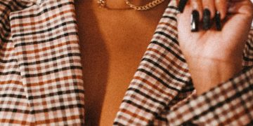 woman in white and black checkered button up shirt