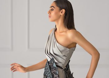 woman in gray one shouldered mini dress